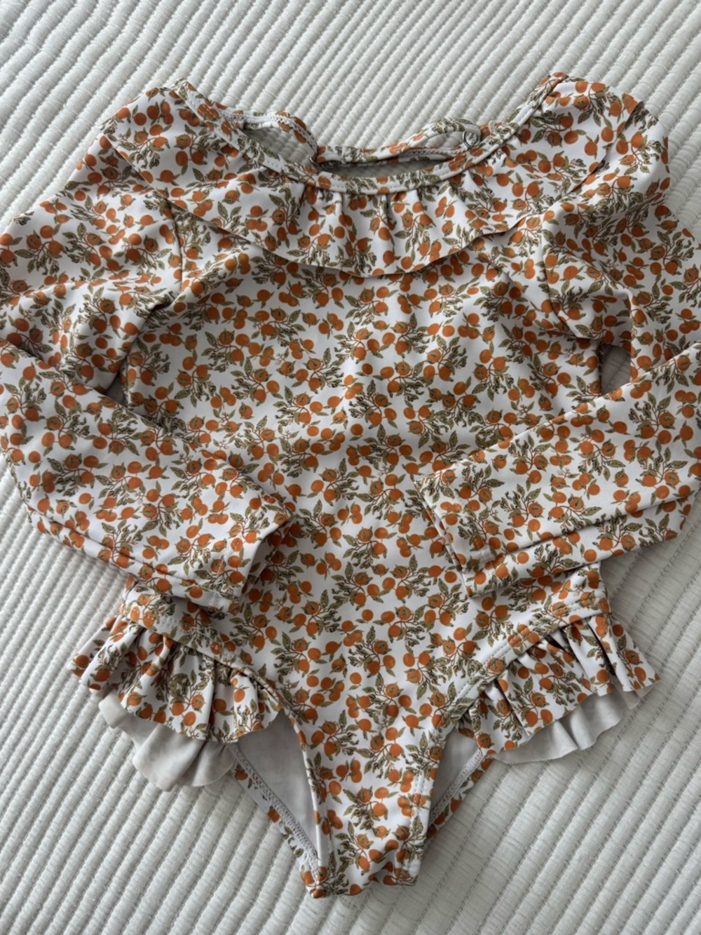 Girls White One-Piece Swimsuit with Orange Floral Print and Ruffles